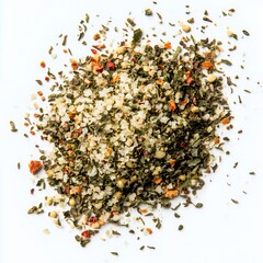 A vibrant mix of dried herbs and spices on a white background, showcasing their textures.