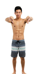 Fototapeta premium Young fit shirtless Asian man in striped board shorts standing and giving two thumbs down with a disapproving facial expression, isolated on a plain transparent background.