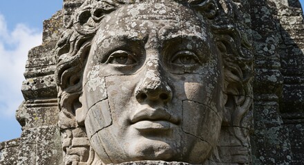 Obraz premium Ancient Stone Face Close-up of a Weathered Stone Sculpture, Intricate Detail and Mysterious Expression