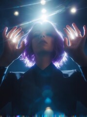 Photograph of hands and head, dark room with blue light rays from the top, a girl with purple hair wearing a black suit kneeling and facing the camera,