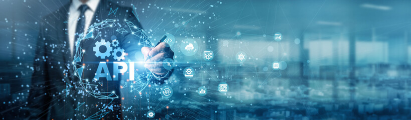 A hand of a businessman drawing graphs using an API to analyze data, optimize performance, and generate insights for better decision-making in real-time.