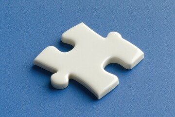 Obraz premium A close-up view of a single white puzzle piece resting on a blue background. symbolizing problem-solving and completion in various contexts like education and strategy