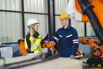 Technician Engineer in Factory, Maintaining and Repairing Robotic Arms Machinery, Ensuring Smooth...