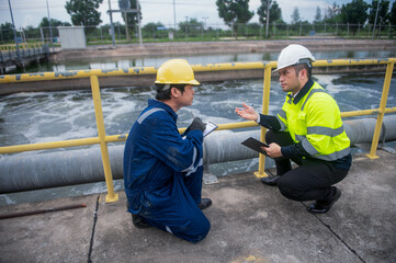 A professional engineer and technician are working together to seriously check the water quality in...