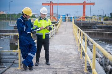 A professional inspector and a water treatment plant engineer are working together to check whether...