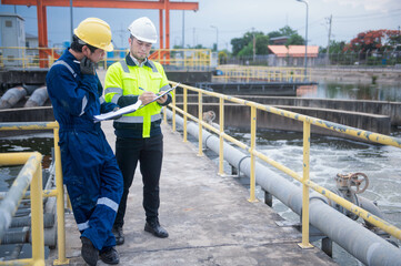 A professional inspector and a water treatment plant engineer are working together to check whether...