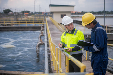 An inspector and a water treatment plant engineer are working together to plan a change in the treatment plant's water filter to bring the water up to state standards.