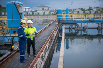 An inspector and an engineer at a water treatment plant are working together to plan the...