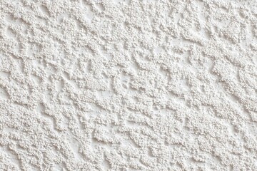 Textured Wall Surface: A close-up shot reveals the intricate texture of a wall, showcasing a detailed pattern of varying depths and peaks, creating a visually interesting surface.