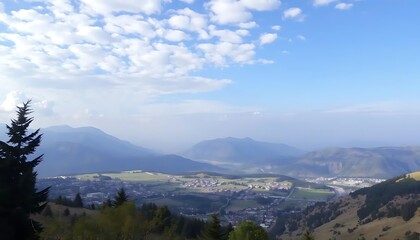 Panoramic Vista of a Serene Valley with Mountains and a Picturesque Sky