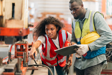 An industrial worker operates machinery in a modern factory environment focusing on production processes quality control mechanical operation workplace safety and efficient material handling