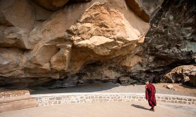 Buddhist monk visit to the Aurangabad Caves, India.