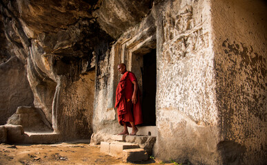 Buddhist monk visit to the Aurangabad Caves, India.