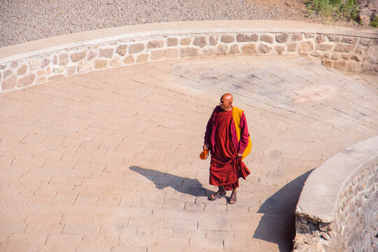 Buddhist monk visit to the Aurangabad Caves, India.