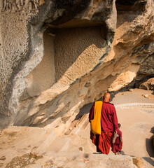 Buddhist monk visit to the Aurangabad Caves, India.