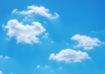 Fluffy White Clouds Floating in a Clear Blue Sky