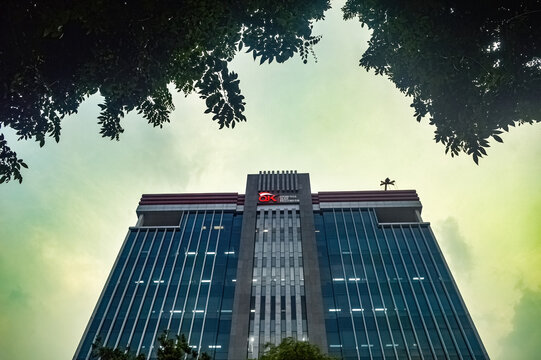 office building belonging to the Indonesian financial services authority (OJK) with a twilight sky in the background, indonesia, 17 November 2023.