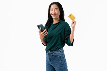 Beautiful Asian woman holding credit card and using smartphone on white background.