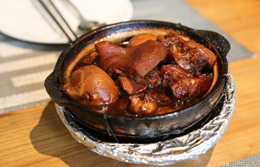 Braised pork trotters Chinese cuisine meat dish closeup view