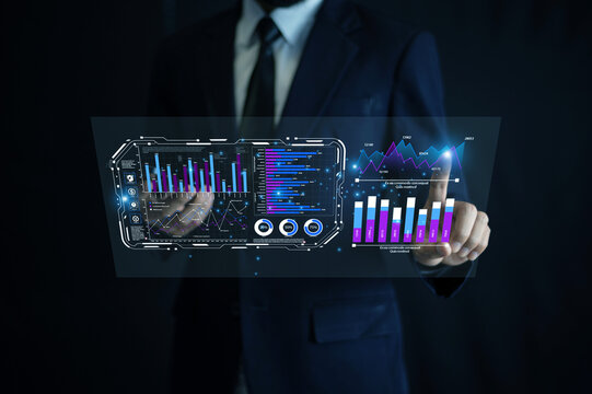 Businessman using AI automation technology to analyze financial data through a futuristic virtual dashboard interface for smart investment decisions