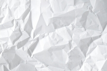 Crumpled white paper sheets texture background