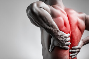 Man holding his back in pain with red overlay representing muscle injury, inflammation, and healthcare emergency