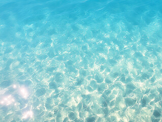 Obraz premium Summer beach background. Crystal clear tropical ocean water. Calm waves and glimmering sunshine. Drone view.