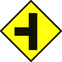 Fototapeta premium Yellow diamond traffic sign with black T shape indicating a T junction from the left. Used to alert drivers of upcoming intersections and merging roads. Road sign symbol