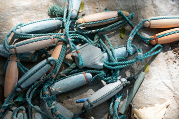 Tangled Maritime Equipment with Wooden and Plastic Floats