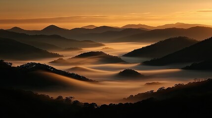 Layers of mountains and valleys bathed in golden morning light