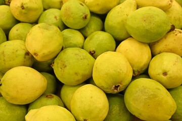 Full frame of ripe guayaba or guava fruit ready for sale.