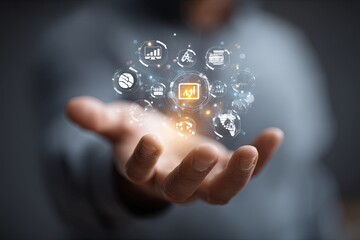 Hand Holding Information Icon with Various Business, Finance, and Technology Symbols in a Modern Digital Interface Concept
