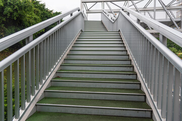 Fototapeta premium Urban outdoor steel pedestrian bridge steps landscape