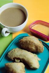 Crispy Fried Snacks with Dipping Sauce on Colorful Background