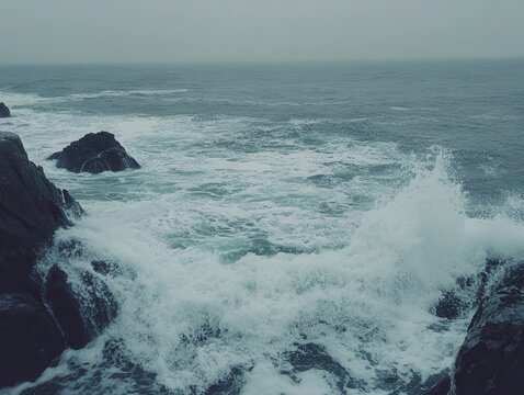 Crashing Waves on Rocky Coastline on Overcast Day Eye Level Shot of Ocean Spray and Dramatic Landscape - Powered by Adobe