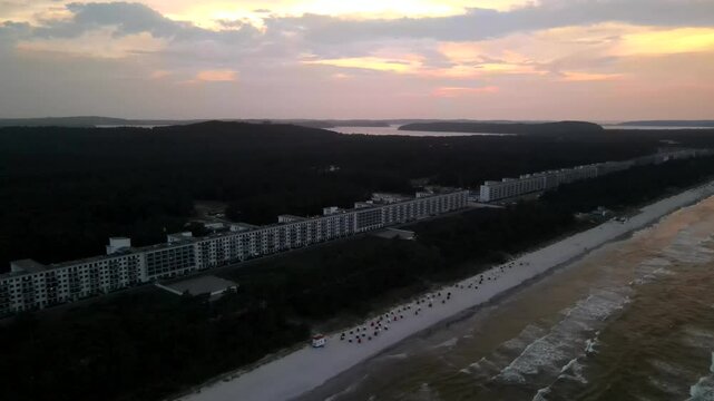 Aerial sunset over Prora, R&uuml;gen. The long beachfront complex borders the Baltic Sea, bathed in warm twilight hues.