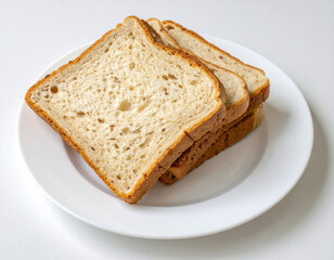 Soft White Bread Slices Stacked on a Plate