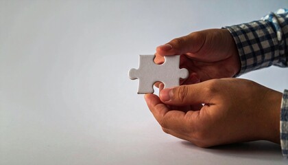 Assembling a puzzle piece indoor setting close-up shot minimalist background concept of problem solving