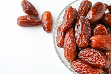 Dates fruit tunisia, Tunisian honey dates, in bowl isolated on white background