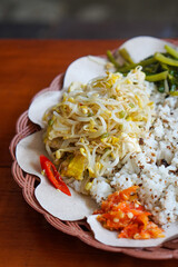 Tutug oncom rice from Sundanese cuisine, captured on May 15, 2025. Savory steamed rice mixed with fermented soybean cake, served with traditional Sundanese sides