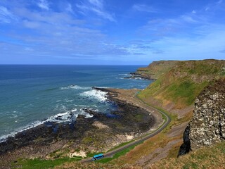 The Giant's Causeway, a UNESCO World Heritage Site on Northern Ireland's Antrim Coast, features 40,000 interlocking basalt columns formed by volcanic activity. Its hexagonal stones and coastal beauty 