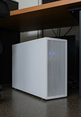 Modern White Air Purifier on a Dark-Toned Office Floor