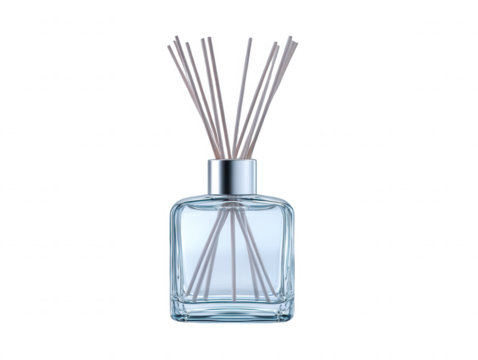 A stylish diffuser with wooden sticks sits against a white backdrop to infuse a room with a refreshing aroma and elevate the ambiance of the interior space.