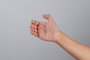 Curved human hand with slightly bent fingers and visible palm in relaxed pose suggesting casual grip or readiness to take action isolated on clean background