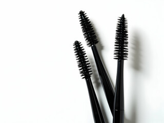 Close-up of High-Quality Mascara Brushes, A Detailed Look at Cosmetic Applicators for Eyelash Enhancement and Beauty Product Presentation on a Clean Surface