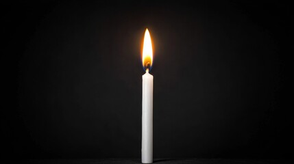 A single white candle with a flickering flame against a black background.