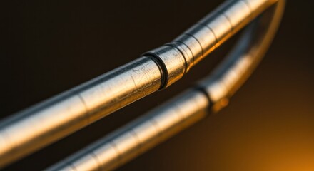 Metallic Tubes with Reflections and Connections Under Warm Lighting Conditions