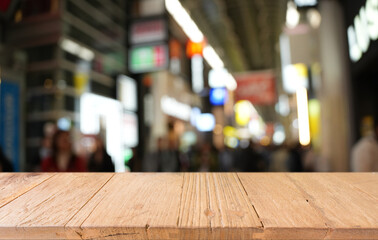 Empty wood table top and blur of restaurant background selective focus product display