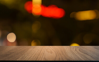 Empty wood table top and blur of restaurant background selective focus product display