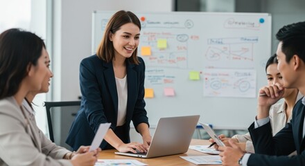 Naklejka premium Smiling leader presents data analysis to diverse team in modern office setting